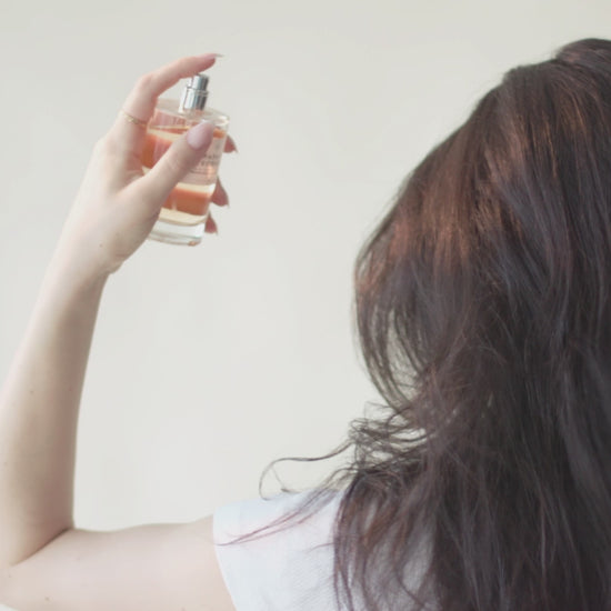 STEP 02 - Apply fragrance to a hairbrush or as a light mist through your hair. Spray on clothes and bedding for a 360 sensorial experience.